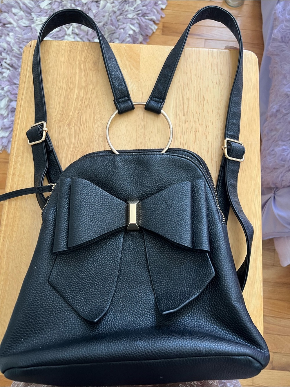 Crossi Ring Double Bow Backpack In Black Pebbled Faux Leather 11”x10”x5”